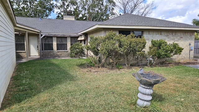 exterior space with a lawn