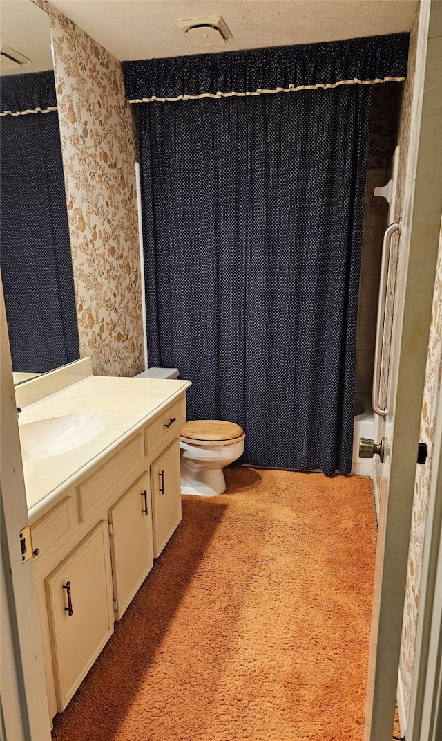 full bathroom with vanity, toilet, and shower / bath combo