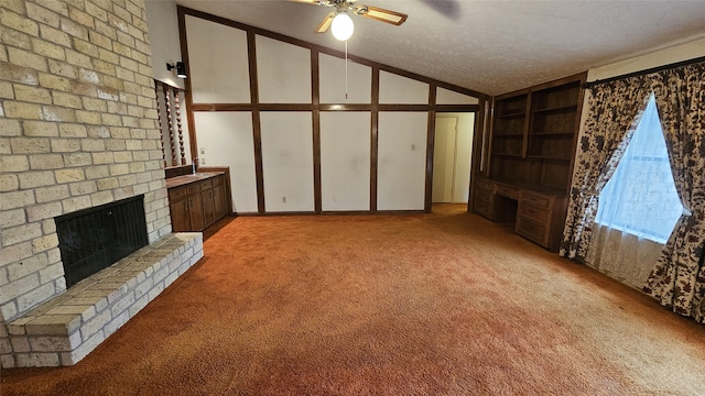 unfurnished living room with light carpet, a brick fireplace, a textured ceiling, ceiling fan, and high vaulted ceiling