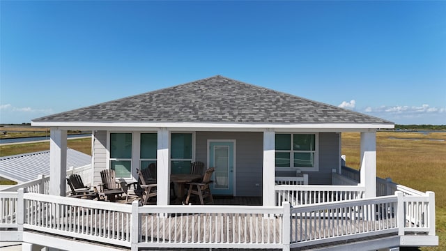1286 Lagoon Dr, Crystal Beach, TX 77650 - back of house featuring a shingled roof and a deck