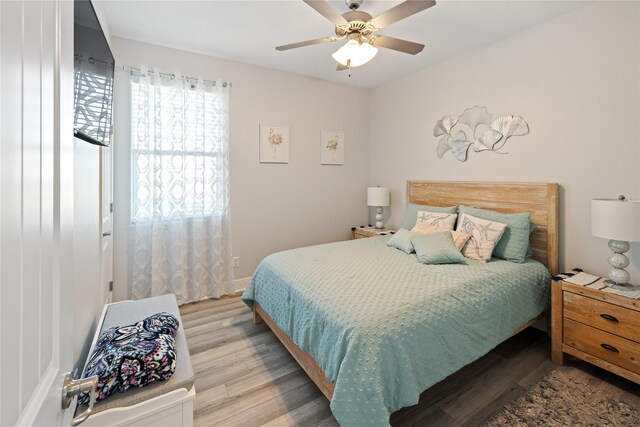 1286 Lagoon Dr, Crystal Beach, TX 77650 - bedroom with light wood-style flooring and a ceiling fan
