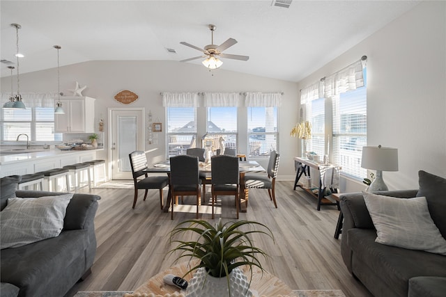 1286 Lagoon Dr, Crystal Beach, TX 77650 - living area with vaulted ceiling, ceiling fan, and light wood-type flooring