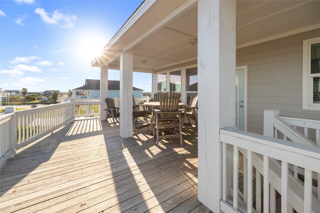 1286 Lagoon Dr, Crystal Beach, TX 77650 - wooden terrace featuring outdoor dining area
