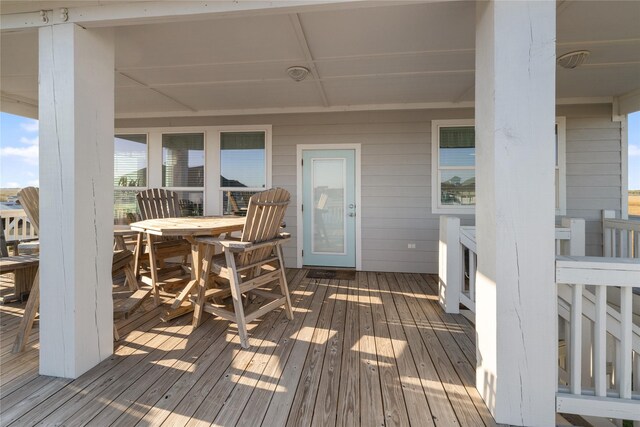 1286 Lagoon Dr, Crystal Beach, TX 77650 - wooden deck featuring outdoor dining area