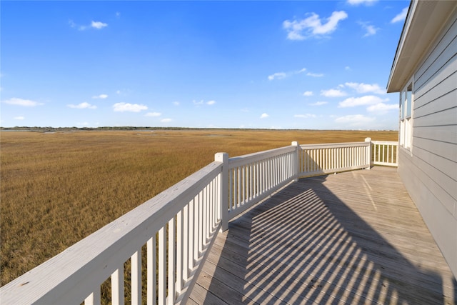 wooden deck featuring a rural view