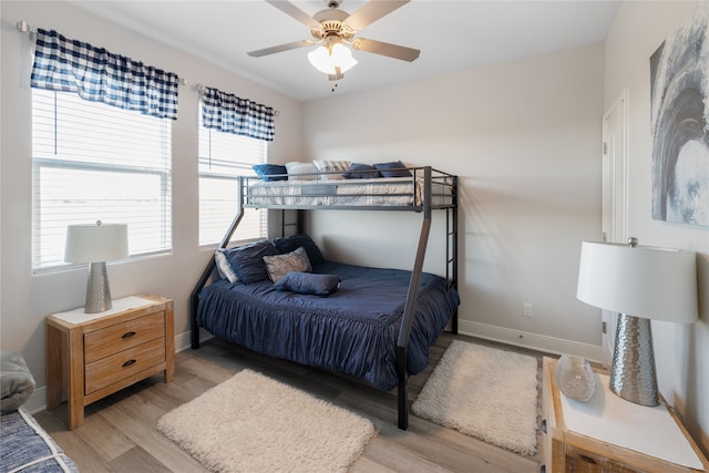 bedroom featuring light hardwood / wood-style flooring and ceiling fan