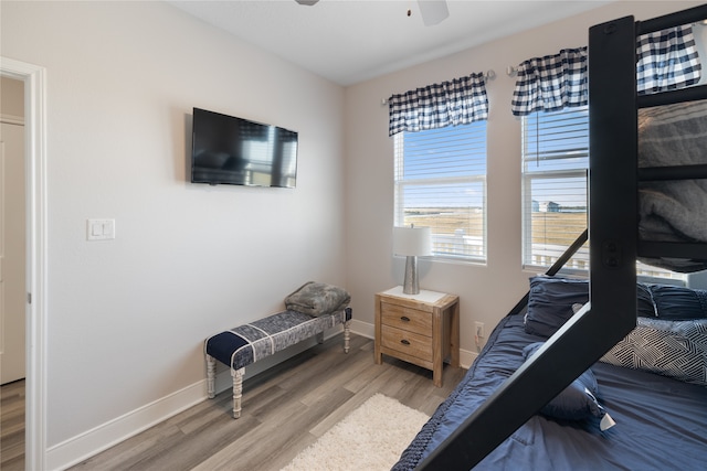 bedroom with wood-type flooring and ceiling fan