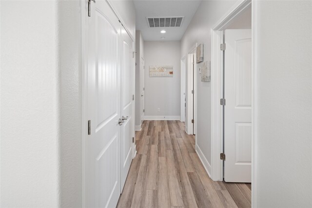 1286 Lagoon Dr, Crystal Beach, TX 77650 - corridor featuring light wood-style flooring, baseboards, and recessed lighting