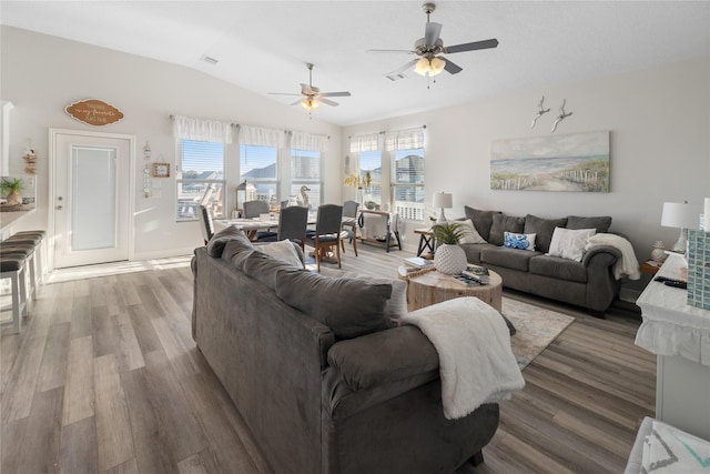 1286 Lagoon Dr, Crystal Beach, TX 77650 - living area featuring vaulted ceiling, wood finished floors, ceiling fan, and baseboards
