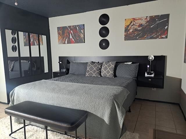 bedroom with tile patterned flooring