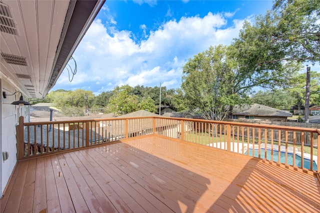 wooden terrace with a pool