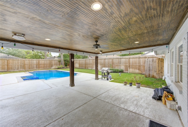 view of pool featuring a lawn, ceiling fan, and a patio