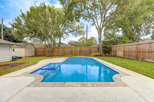 view of pool featuring a storage unit, a yard, and a patio area