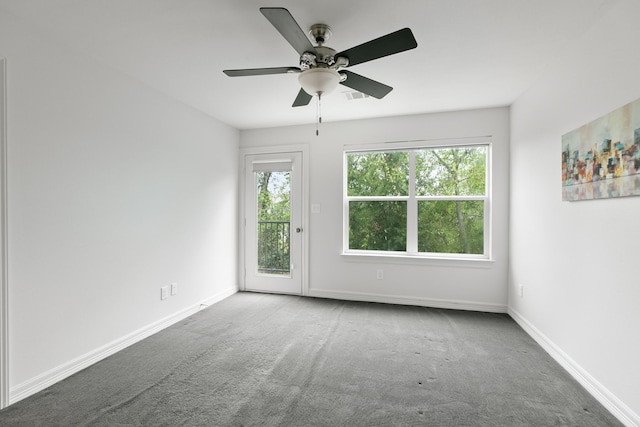 carpeted empty room featuring ceiling fan