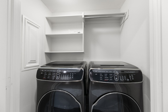 washroom with separate washer and dryer