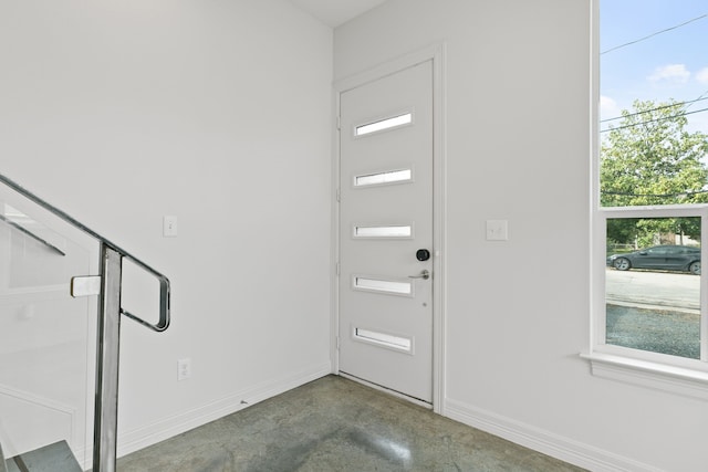 foyer featuring concrete floors