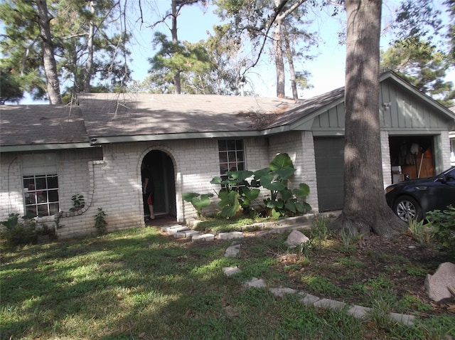 view of front of property with a garage and a front yard