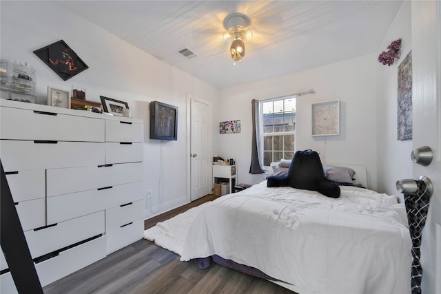 bedroom featuring dark wood-type flooring