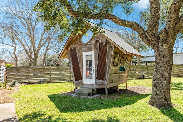 view of outbuilding with a lawn