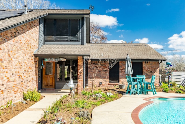 back of property featuring a patio