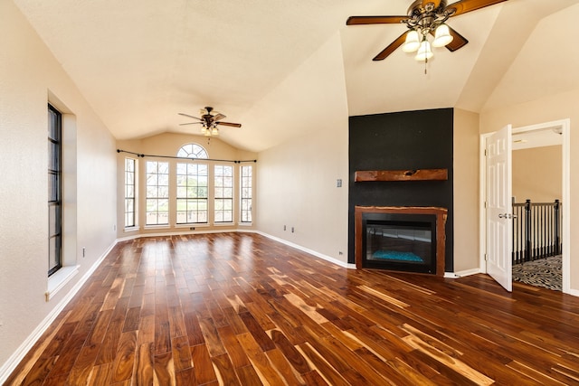 unfurnished living room with dark hardwood / wood-style floors, vaulted ceiling, and ceiling fan