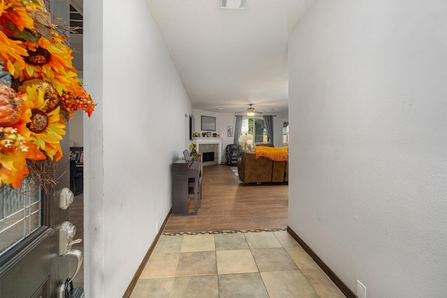 hallway with light hardwood / wood-style flooring