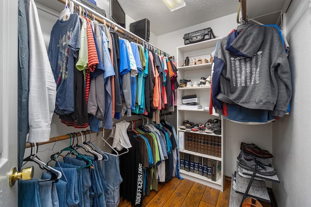 walk in closet featuring dark hardwood / wood-style flooring