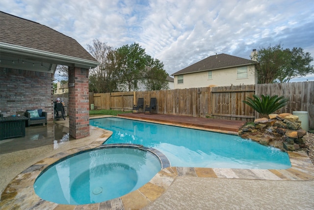 view of pool featuring an in ground hot tub and a patio area