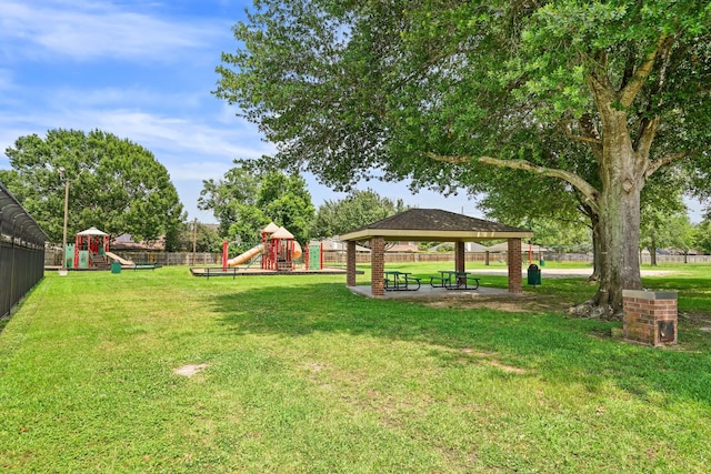 view of property's community featuring a playground, a yard, and a gazebo