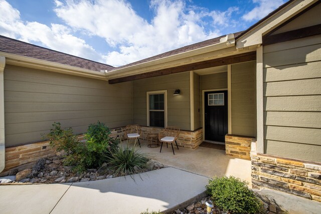 doorway to property featuring a patio area