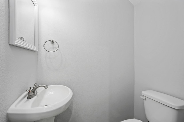 bathroom with toilet and sink