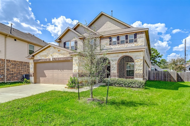 view of front of house featuring a garage and a front lawn