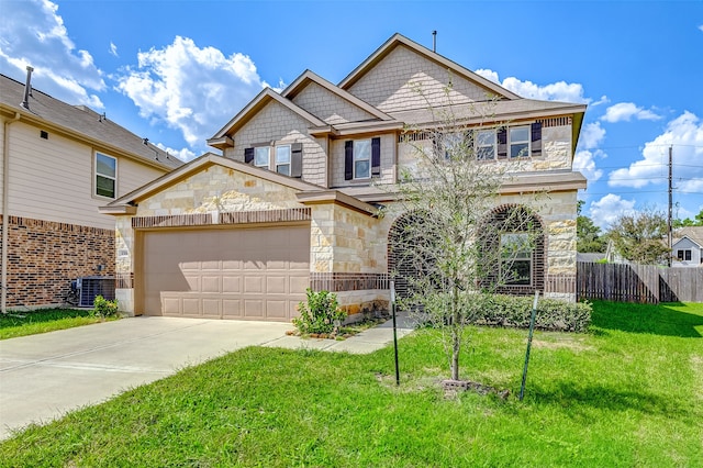 view of front of house with a front lawn, a garage, and central AC unit