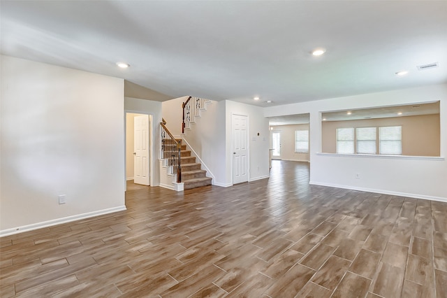 unfurnished living room with wood-type flooring