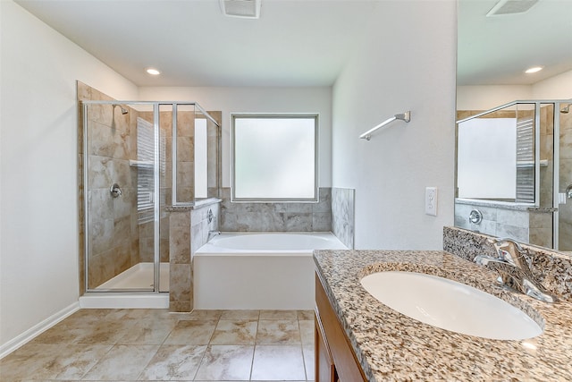 bathroom featuring shower with separate bathtub and vanity