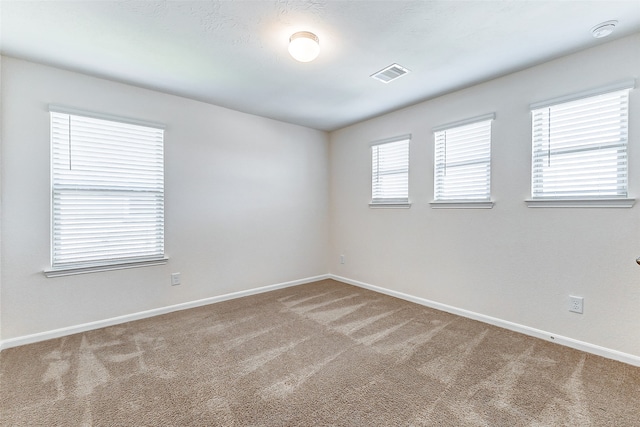 spare room with carpet flooring