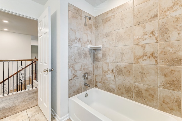 bathroom featuring tile patterned flooring and tiled shower / bath combo