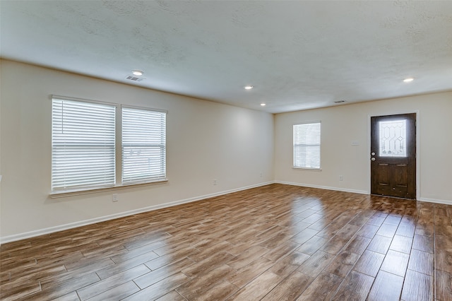 foyer entrance with light hardwood / wood-style floors