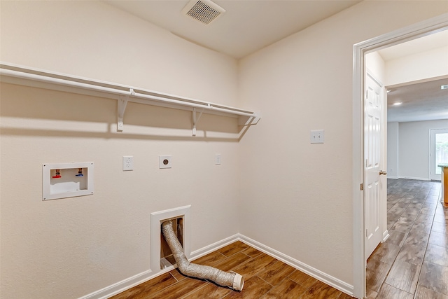 laundry room featuring washer hookup, wood-type flooring, and hookup for an electric dryer