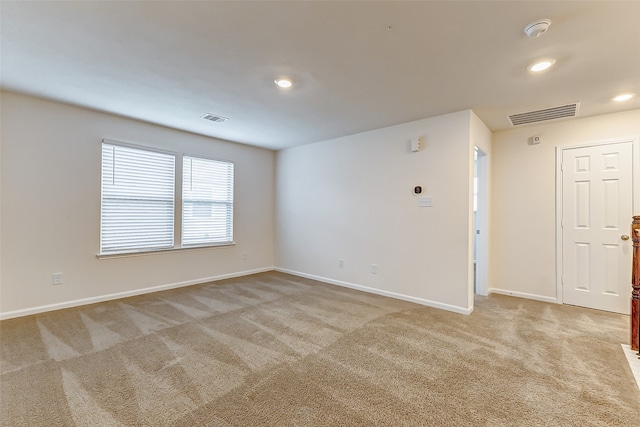 empty room featuring light carpet