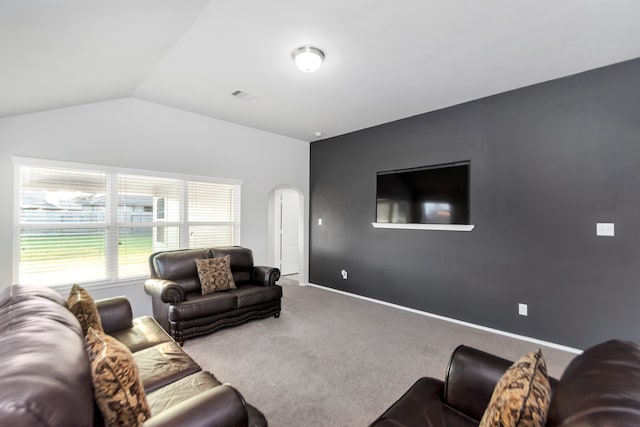 living room with carpet and vaulted ceiling