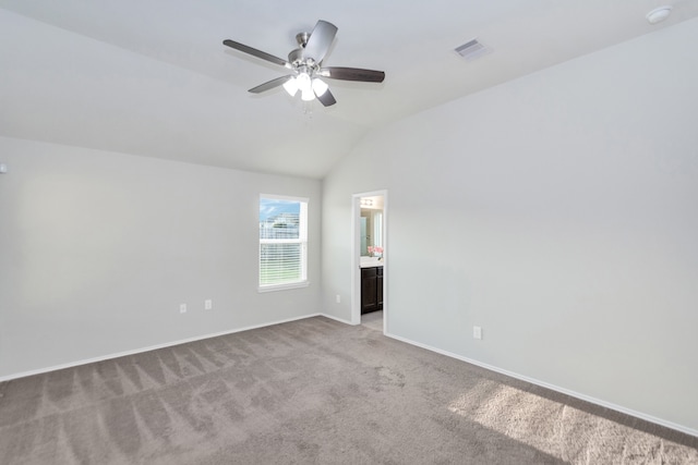 carpeted empty room featuring lofted ceiling and ceiling fan