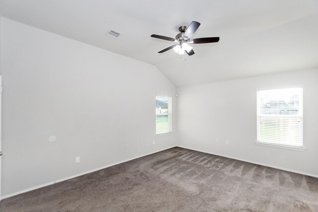 carpeted empty room with lofted ceiling and ceiling fan