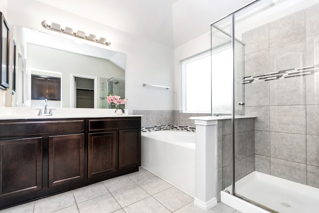 bathroom featuring separate shower and tub, vanity, and tile patterned floors