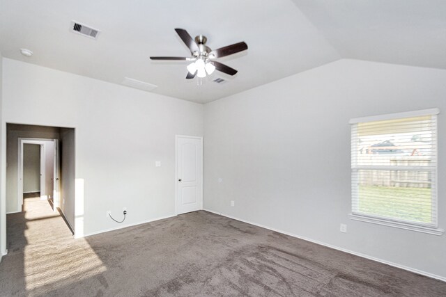 spare room with carpet floors, ceiling fan, and lofted ceiling