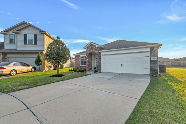 view of front of home with a front lawn and a garage