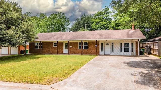 single story home with a front yard, covered porch, and a garage