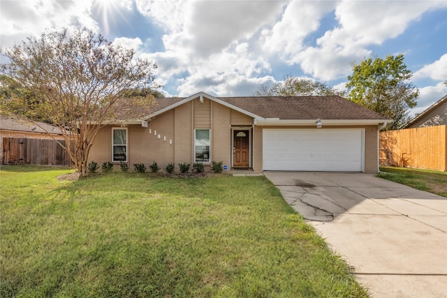 ranch-style house featuring a front lawn and a garage