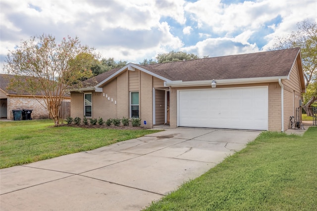 ranch-style home featuring a garage and a front yard