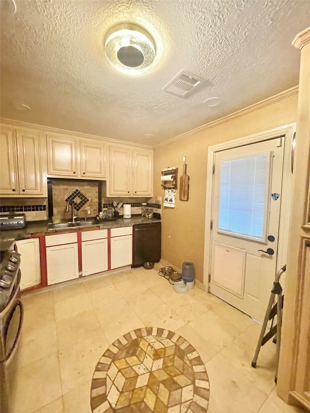 kitchen with a textured ceiling, decorative backsplash, sink, and light tile patterned floors